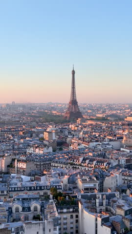Experience Stunning Aerial Views of the Majestic Eiffel Tower in the Heart of Paris. Vertical video