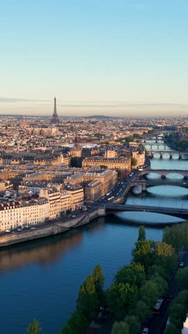 Experience Stunning Aerial Views of the Majestic Eiffel Tower in the Heart of Paris. Vertical video