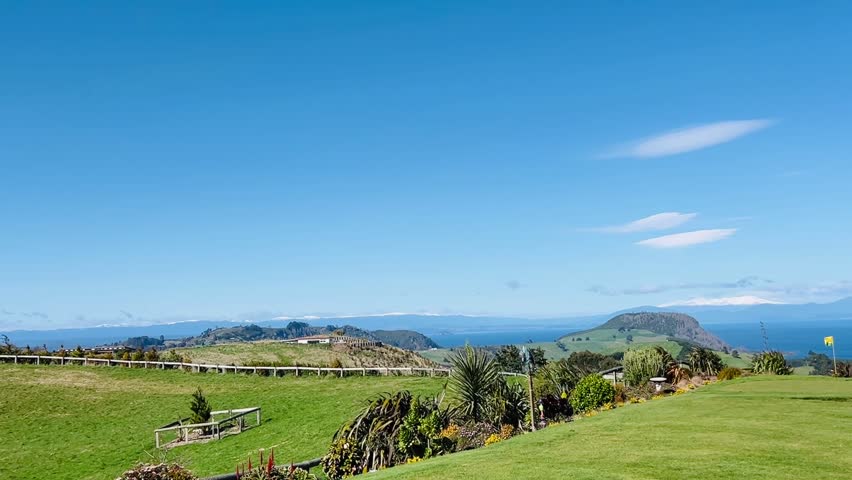 Scenic Golf Course Overlooking a Bay and Mountains in New Zealand