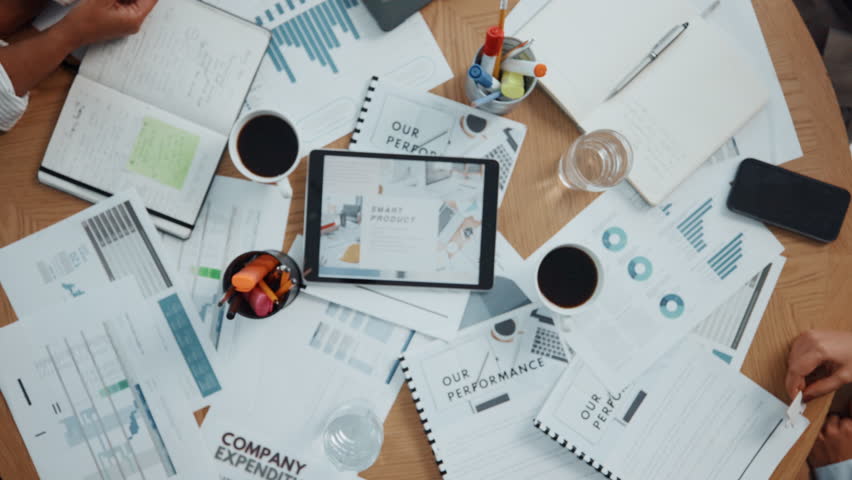 Business people, hands or jigsaw puzzle with team or documents above for problem solving in office. Top view, group or employees with pieces for cognitive collaboration or unity together in workplace