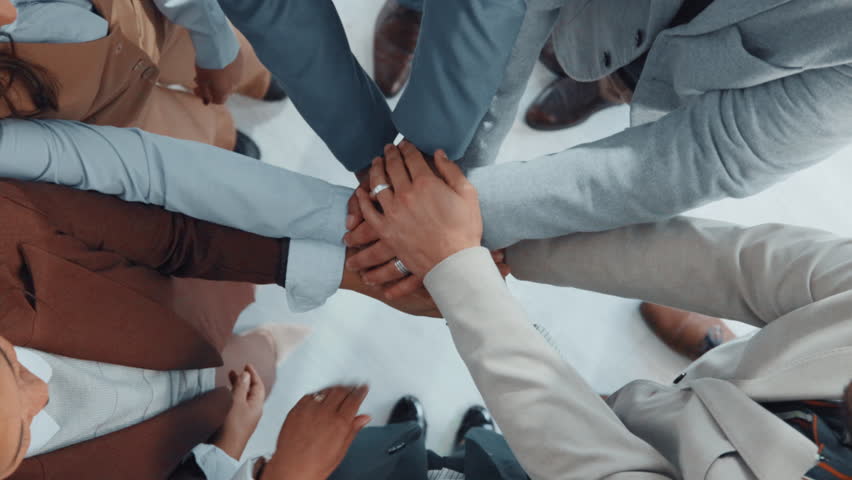 Business people, hands together or meeting with applause above for team success or unity in office. Group, employees or clapping in huddle with pile or stack for collaboration, mission or achievement