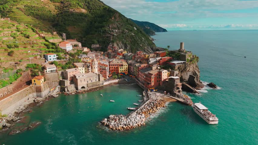 Aerial view of the picturesque town of Vernazza, Cinque Terre, Italian Riviera, Liguria, Italy. Stunning historic village with colorful buildings nestled between cliffs and the Ligurian Sea. 