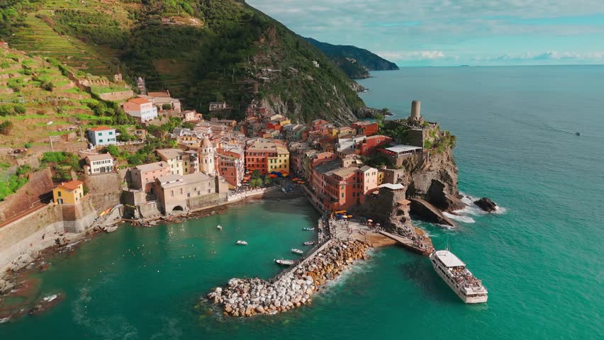 Aerial view of the picturesque town of Vernazza, Cinque Terre, Italian Riviera, Liguria, Italy. Stunning historic village with colorful buildings nestled between cliffs and the Ligurian Sea. 