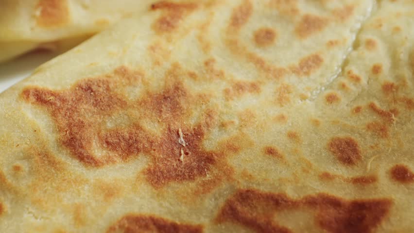 Freshly fried hot chicken quesadilla on a wooden board. Mexican quesadillas. High quality 4k footage