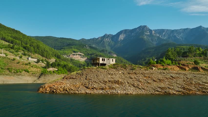 
old house on a lake and mountain view