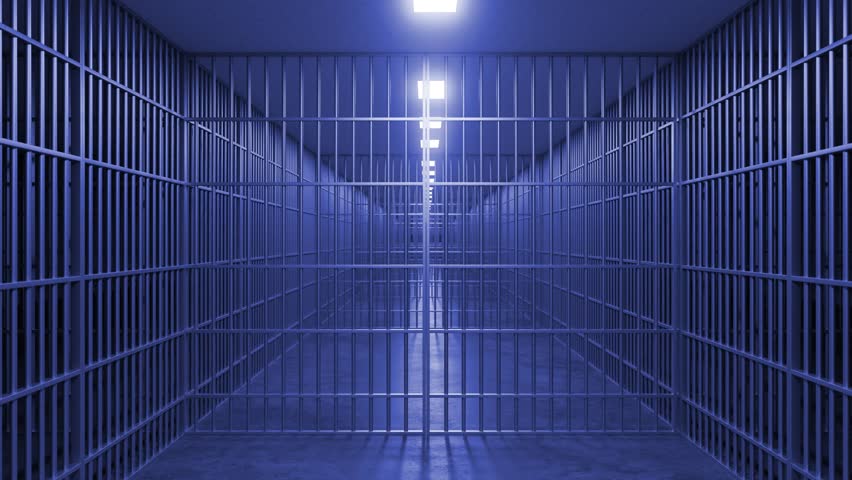 Metal bars of a prison cell door are opening slowly, revealing a long, empty corridor with more cells and dim lighting, creating a sense of confinement and isolation