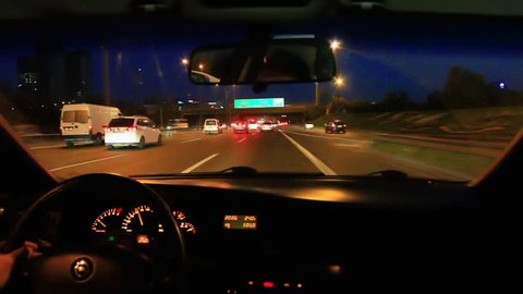 Freeway driving night. Driving from car interior. 
