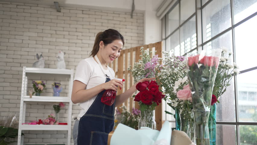 Young entrepreneurs are working at florist shop. Small business and leisure activity.