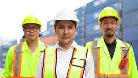 group of Confident asian industrial team standing together at a container port. strong teamwork unity trust and commitment in logistics and shipping. leadership and expertise in global supply chain. - Powered by Shutterstock - Get 15% off with code: PIKWIZARD15