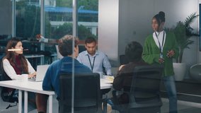 Confident CEO leads diverse startup tech team in night office meeting, brainstorming strategy, coding ideas, business growth, and software development with programmers and professionals collaborating - Powered by Shutterstock - Get 15% off with code: PIKWIZARD15