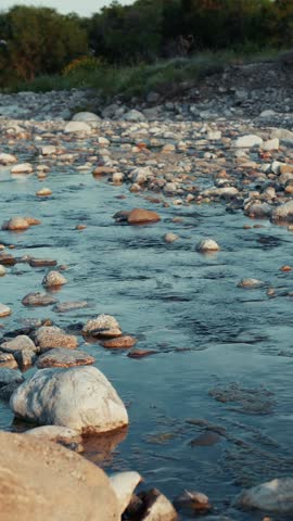River Flows Through Rocks Giving A Sense Of Religious Relaxation