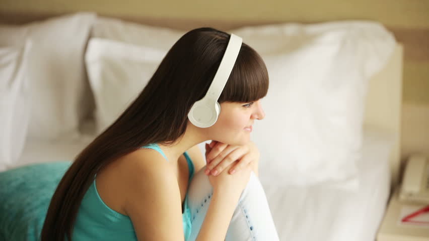 Girl listening music and thinking about something
