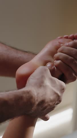 Foot massage therapy in wellness salon