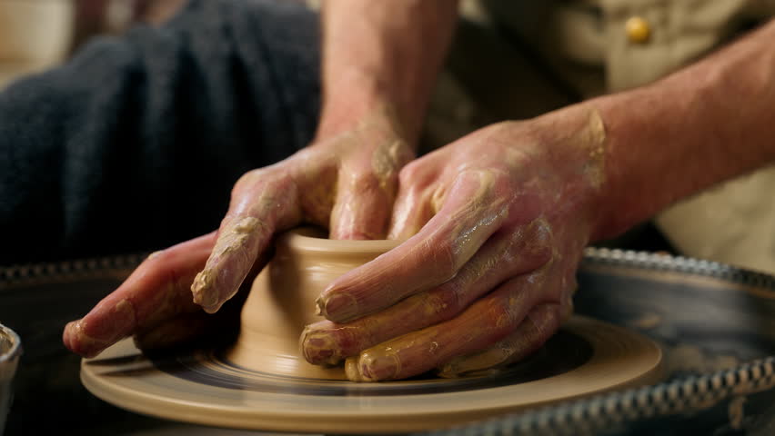Craftsman unrecognizable man making vase jug pot wet clay pottery wheel craftsmanship workshop hobby potter artisan handicraft ceramic sculpting shaping modeling studio male master class hands create