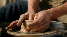 Craftsman unrecognizable man making vase jug pot wet clay pottery wheel craftsmanship workshop hobby potter artisan handicraft ceramic sculpting shaping modeling studio male master class hands create - Powered by Shutterstock - Get 15% off with code: PIKWIZARD15