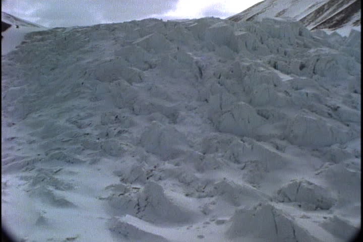 ANTARCTICA - CIRCA FEBRUARY 1997: Camera passes over rough, chunky hills of ice.