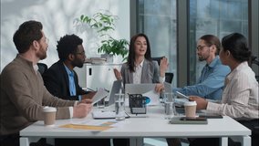 Multicultural Caucasian Indian group businesswomen businessmen women men business teamwork office coworkers females males discuss project together talking paperwork documents cooperate diverse people - Powered by Shutterstock - Get 15% off with code: PIKWIZARD15