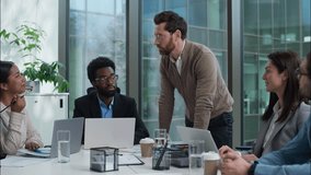 Multiracial business group multiethnic women men businesspeople office meeting briefing Caucasian leader talking discussing planning African American Indian employes team coworkers negotiation startup - Powered by Shutterstock - Get 15% off with code: PIKWIZARD15