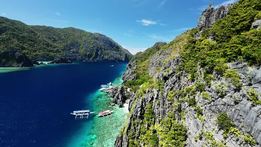 Stunning aerial view of El Nido cliffs and turquoise sea in Palawan, Philippines captured by drone