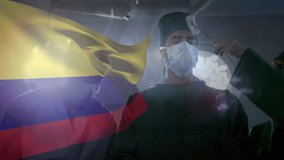 Forceps delivering gauze initiating surgeon inspecting for sterility under lamp with Colombian flag. Medical, teamwork, hospital, healthcare, innovation, professionalism, clinical - Powered by Shutterstock - Get 15% off with code: PIKWIZARD15