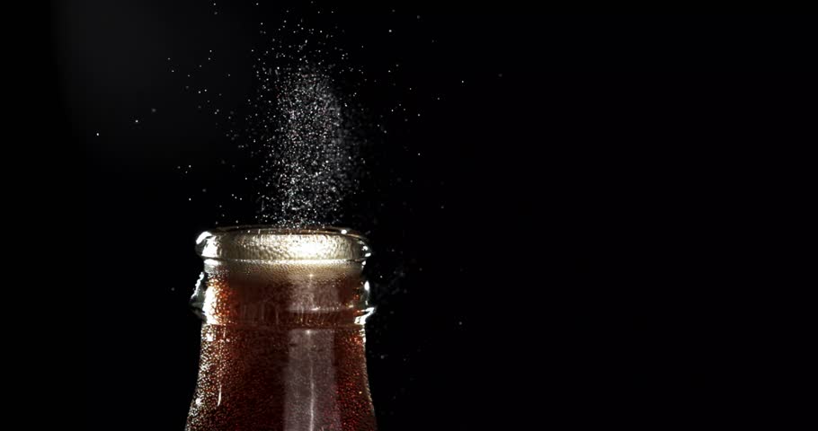 Slow Motion Close-Up of a Cool Refreshing Drink with Ice Cubes and Fizzy Bubbles in a Transparent Glass – Real-Time Footage Capturing the Chill, Sparkle, and Refreshment of a Carbonated Beverage on 