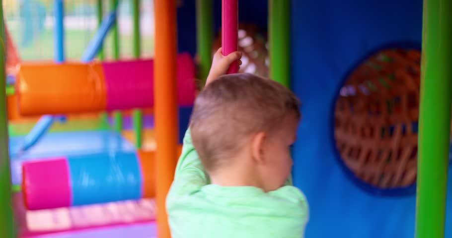 Child Playing in Colorful Indoor Playground