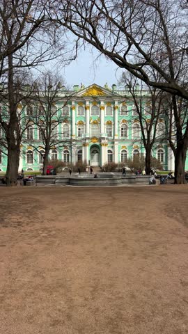 ST. PETERSBURG - APRIL 10, 2023: Winter Palace in the daytime on a cloudy April afternoon. View of the State Hermitage Museum in St. Petersburg. The museum on the Palace Square. 4K