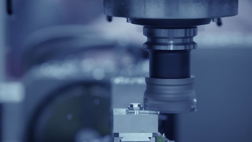 High-precision cnc milling machine in action with metalwork focus.