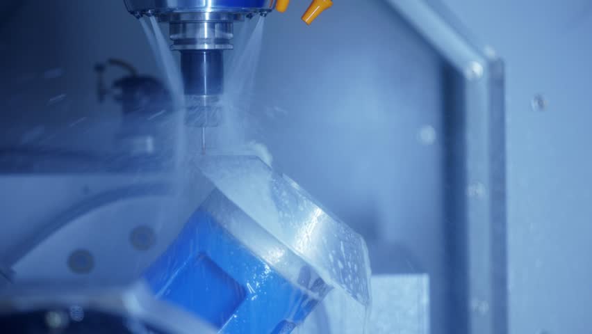 CNC milling machine cutting metal with high precision accuracy and speed.