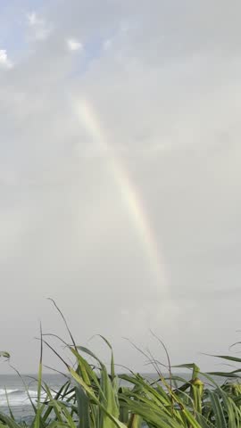 Beautiful Rainbow Across the Sky After Rain – Colorful Natural Phenomenon Over Scenic Landscape, Capturing Weather Change, Peaceful Atmosphere, and Vibrant Spectrum in a Clear or Cloudy Sky