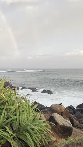 Beautiful Rainbow Across the Sky After Rain – Colorful Natural Phenomenon Over Scenic Landscape, Capturing Weather Change, Peaceful Atmosphere, and Vibrant Spectrum in a Clear or Cloudy Sky