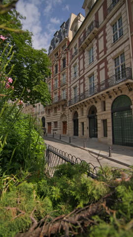 Elegant woman strolls through iconic Paris streets enjoying historic architecture and romantic scenery while visiting the capital of France for sightseeing