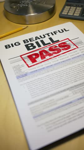 Close-up vertical view of a political document titled “BIG BEAUTIFUL BILL” stamped with a bold red “PASS.” Scene includes a pencil, calculator, and desk symbolizing legislation approval or policy.