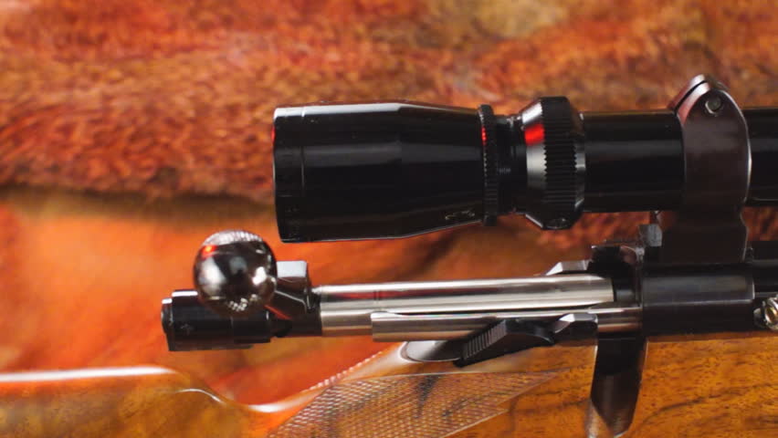 Classic American Hunting rifle with bolt open and ammunition