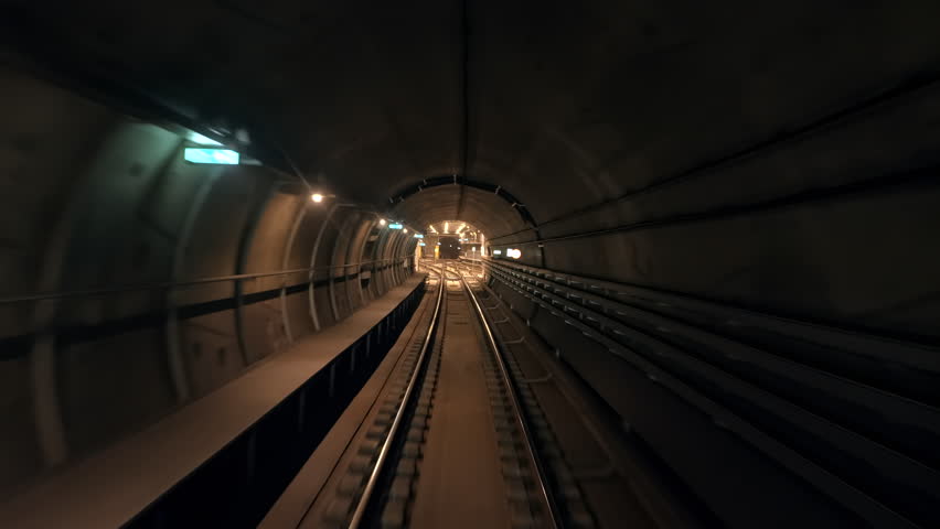 POV shot riding through the underground tunnels of the Copenhagen Metro system in Copenhagen, Denmark.	