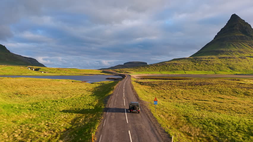 Car Through Iceland Landscape mountains Epic Scenic Road Trip Scene. Kirkjufell