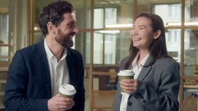 Happy laughing business coworkers drinking coffee break friendly talking at office Caucasian Korean businessman businesswoman work resting employees share ideas conversation woman man paper cup drink - Powered by Shutterstock - Get 15% off with code: PIKWIZARD15