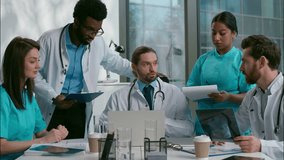 Multicultural ethnic five diverse people doctors nurses Caucasian Indian African clinician medical healthcare therapists talk meeting conference disease checkup surgery discussion x-ray tablet clinic - Powered by Shutterstock - Get 15% off with code: PIKWIZARD15