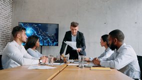 Business team meeting discussing strategies and progress in modern office - Powered by Shutterstock - Get 15% off with code: PIKWIZARD15