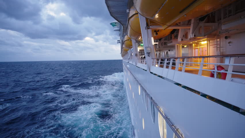 A grand cruise ship glides over the deep blue ocean under a picturesque sky filled with fluffy clouds, evoking a sense of adventure and relaxation for an unforgettable sea experience