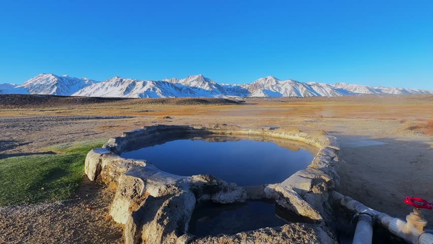 Winter early morning blue sky natural Hilltop Whitmore Wild Willys Hot Springs hot tub soak sunny sky snow covered Mammoth Mountain Minarets aerial drone Convict Canyon peaceful steam forward