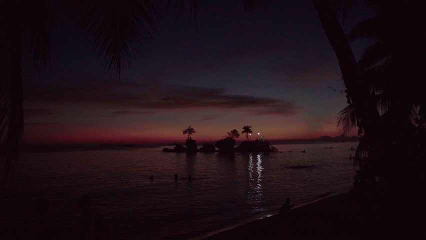 Willy Rock is a tidal island with a statue of the Virgin Mary at the Boracay beach in Philippines