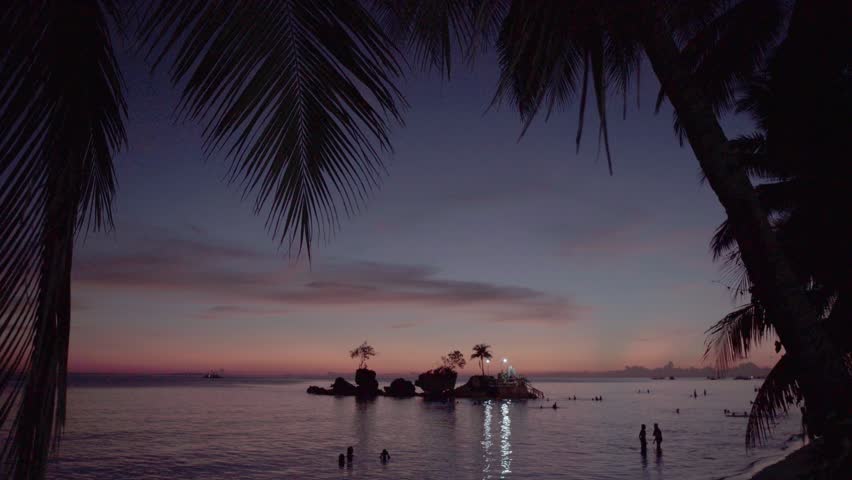 Willy Rock is a tidal island with a statue of the Virgin Mary at the Boracay beach in Philippines