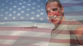 Technology creator starting recording by pivoting lens greeting viewers with US flag overlay. Patriotism, coastal, nature, relaxation, outdoor, serenity, voyage - Powered by Shutterstock - Get 15% off with code: PIKWIZARD15