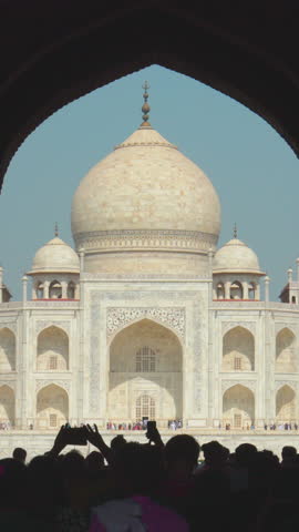 Agra, Uttar Pradesh, India. People visiting one of Seven world wonders - Fabulous Taj mahal. Famous indian islamic heritage at sunny day. Popular Place. People walking near Great Gate, Dharmapuri