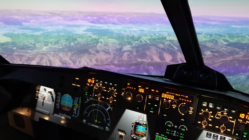 Inside The Airbus A320 Cockpit With High-definition Widescreen Showing Realistic Mountain View - Flight Simulator. - closeup shot