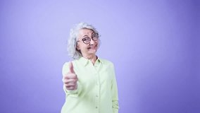 Cheerful senior woman giving thumbs up with joyful smile - Powered by Shutterstock - Get 15% off with code: PIKWIZARD15