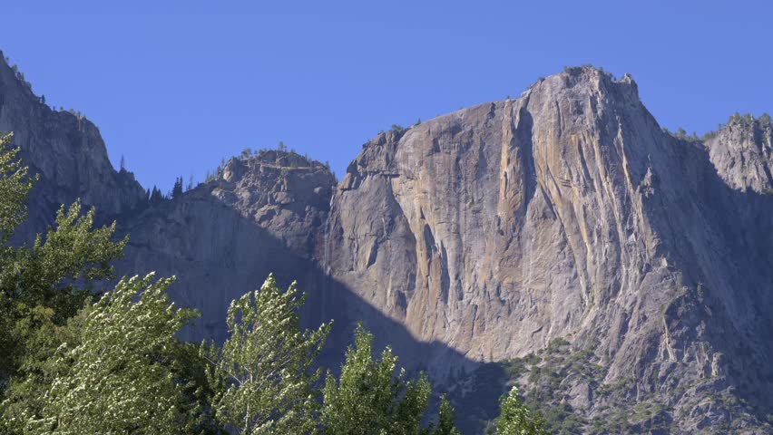 A medium shot of Upper Yosemite Falls in Yosemite National Park, captured without water flowing due to the end of the seasonal snowmelt.