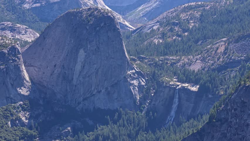 Footage capturing water flowing from Nevada Fall, viewed from an elevated vantage point in Yosemite National Park, California.