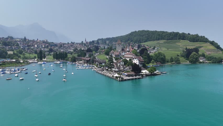 Spiez Town on lake Thun Switzerland establishing aerial shot